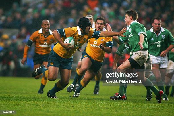 Toutai Kefu of Australia hands off Ronan O'Gara of Ireland during The Permanent TSB Autumn Test Series match between Ireland and Australia held on...