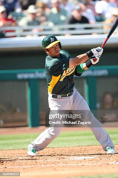 Hiroyuki Nakajima of the Oakland Athletics bats during a spring training game against the Chicago Cubs at Hohokam Park on February 28, 2013 in Mesa,...