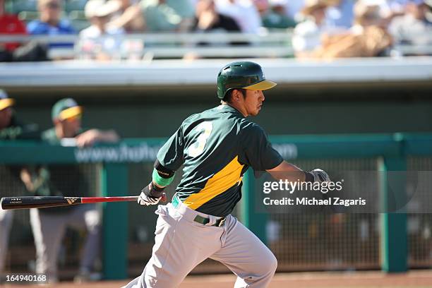 Hiroyuki Nakajima of the Oakland Athletics bats during a spring training game against the Chicago Cubs at Hohokam Park on February 28, 2013 in Mesa,...