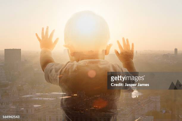 composite of baby and sunset - lens flare isolated stock pictures, royalty-free photos & images