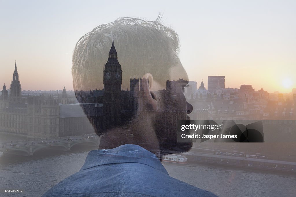 Composite of man looking at houses of parliamnent