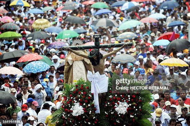 Catholic faithfuls participate in the Via Crucis procession on Good Friday, as part of Holy Week activities in Managua, on March 29, 2013. AFP...