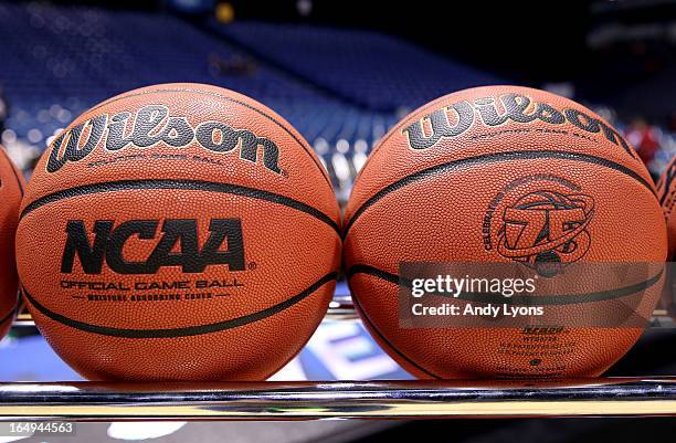 Detail of NCAA Official Wilson basketballs are seen racked up on the court prior to Oregon playing against Louisville during the Midwest Region...