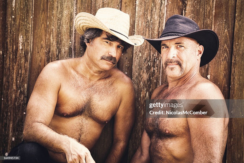 Couple of mature hairy muscular gay cowboys