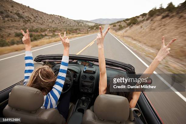 hands up, while driving a convertible. - convertible imagens e fotografias de stock