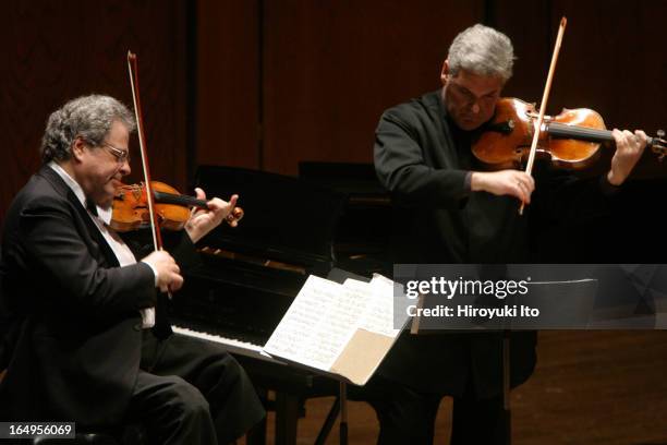 Itzhak Perlman , Pinchas Zukerman performing together at Avery Fisher Hall on Tuesday night, April 25, 2006.This image;From left, Itzhak Perlman and...