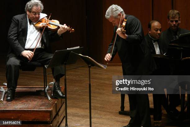 Itzhak Perlman , Pinchas Zukerman performing together at Avery Fisher Hall on Tuesday night, April 25, 2006.This image;From left, Itzhak Perlman ,...