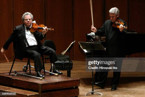 Itzhak Perlman , Pinchas Zukerman performing together at Avery Fisher Hall on Tuesday night, April 25, 2006.This image;From left, Itzhak Perlman and...