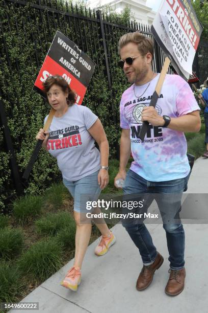 Adam Conover walks the picket line at the SAG-AFTRA and WGA strike on September 6, 2023 at Netflix Studios in Hollywood, California.