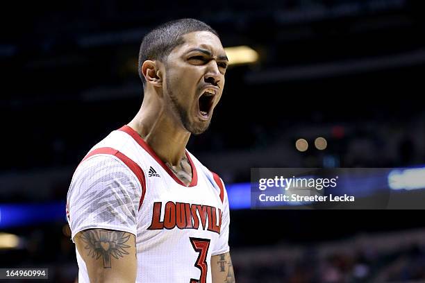 Peyton Siva of the Louisville Cardinals reacts in the first half against the Oregon Ducks during the Midwest Region Semifinal round of the 2013 NCAA...