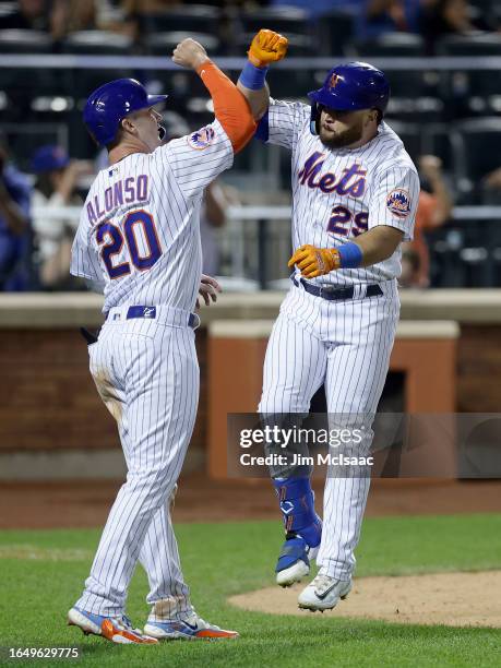 Stewart of the New York Mets celebrates his eighth inning two run home run against the Texas Rangers with teammate Pete Alonso at Citi Field on...