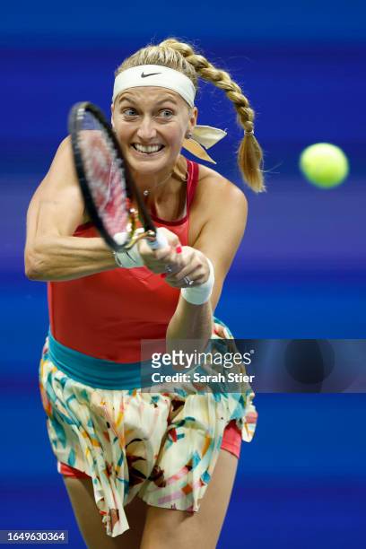Petra Kvitova of Czech Republic returns a shot against Caroline Wozniacki of Denmark during their Women/Men's Singles Second Round match on Day Three...