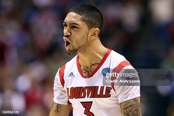 Peyton Siva of the Louisville Cardinals reacts in the second half against the Oregon Ducks during the Midwest Region Semifinal round of the 2013 NCAA...