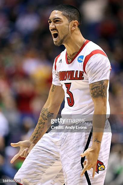 Peyton Siva of the Louisville Cardinals reacts in the second half against the Oregon Ducks during the Midwest Region Semifinal round of the 2013 NCAA...