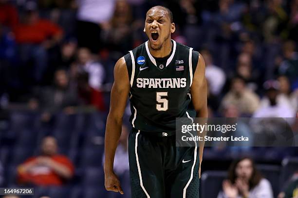 Adreian Payne of the Michigan State Spartans reacts after he made a shot in the first half againnst the Duke Blue Devils during the Midwest Region...