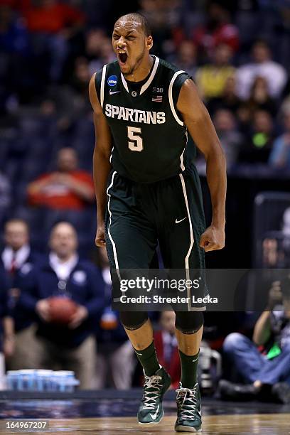 Adreian Payne of the Michigan State Spartans reacts after he made a shot in the first half againnst the Duke Blue Devils during the Midwest Region...