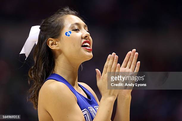 Cheerleader for the Duke Blue Devils performs against the Michigan State Spartans during the Midwest Region Semifinal round of the 2013 NCAA Men's...