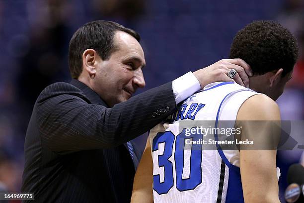 Head coach Mike Krzyzewski of the Duke Blue Devils and Seth Curry celebrate after Duke won 71-61 against the Michigan State Spartans during the...