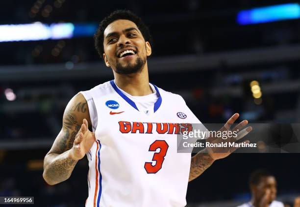 Mike Rosario of the Florida Gators celebrates their 62 to 50 win over the Florida Gulf Coast Eagles during the South Regional Semifinal round of the...