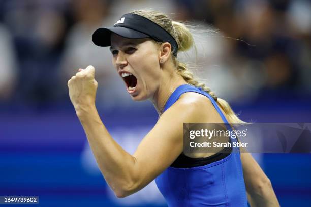 Caroline Wozniacki of Denmark celebrates winning the first set against Petra Kvitova of Czech Republic during their Women's Singles Second Round...