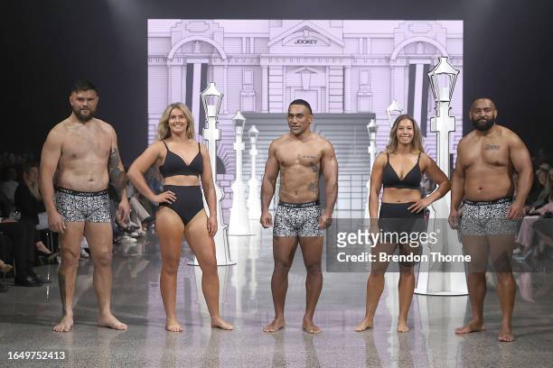 Angus Ta'avao, Alana Bremner, Sevu Reece, Amy du Plessis and George Bower walk the runway during the Jockey show during New Zealand Fashion Week 23:...
