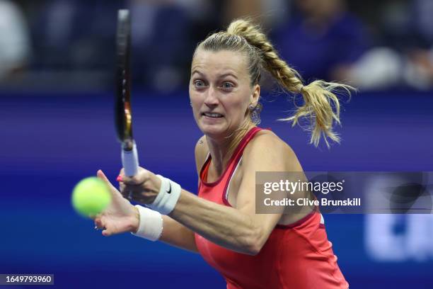 Petra Kvitova of Czech Republic returns a shot against Caroline Wozniacki of Denmark during their Women's Singles Second Round match on Day Three of...