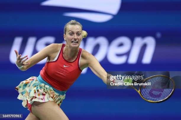 Petra Kvitova of Czech Republic returns a shot against Caroline Wozniacki of Denmark during their Women's Singles Second Round match on Day Three of...