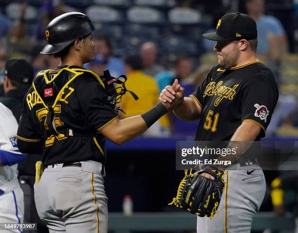 Endy Rodriguez of the Pittsburgh Pirates and David Bednar of the Pittsburgh Pirates celebrate 4-1 win over the Kansas City Royals a at Kauffman...