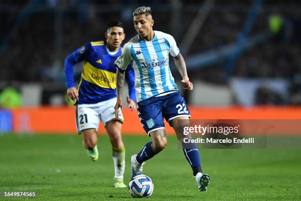 Agustin Almendra of Racing fights for the ball with Ignacio Fernandez Carballo of Boca Juniors during a second leg quarter final match between Racing...