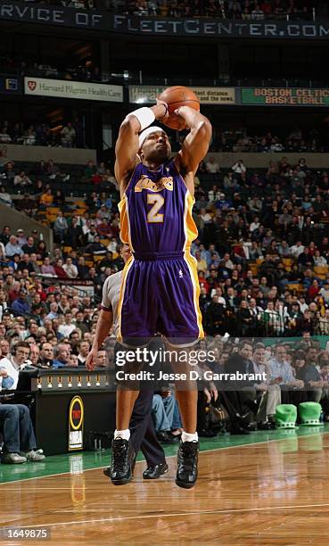 Derek Fisher of the Los Angeles Lakers puts a shot up during the game against the Boston Celtics at the Fleet Center on November 7, 2002 in Boston,...