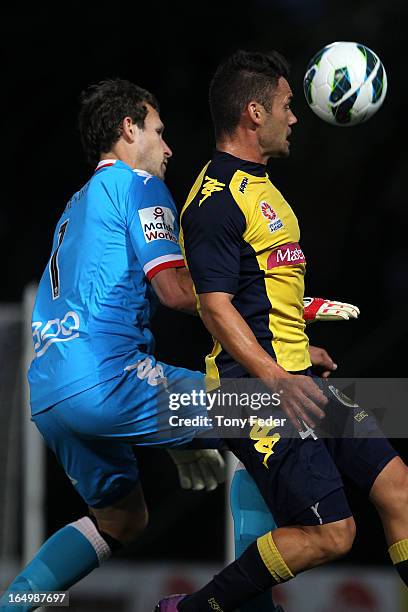 Pedj Bojic of the Mariners heads the ball infront of Melbourne Heart goalkeeper, Clint Bolton during the round 27 A-League match between the Central...