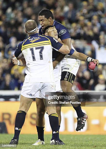 Christian Lealiifano of the Brumbies is congratulated by team mates after kicking a goal to win the game during the round seven Super Rugby match...