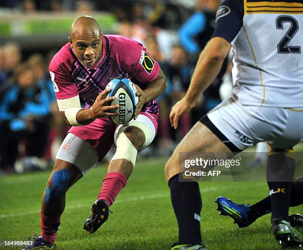 Lionel Mapoe of the Bulls tries to evade a tackle from a Brumbies player during round 7 of the rugby Super 15 match in Canberra on March 30, 2013....