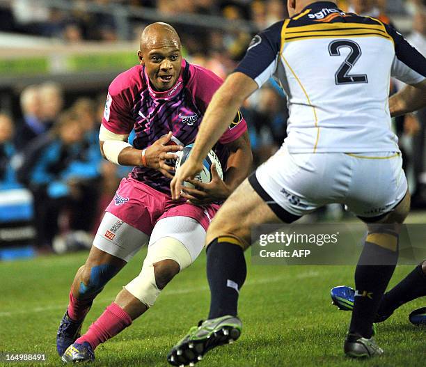 Lionel Mapoe of the Bulls tries to evade a tackle from a Brumbies player during round 7 of the rugby Super 15 match in Canberra on March 30, 2013....