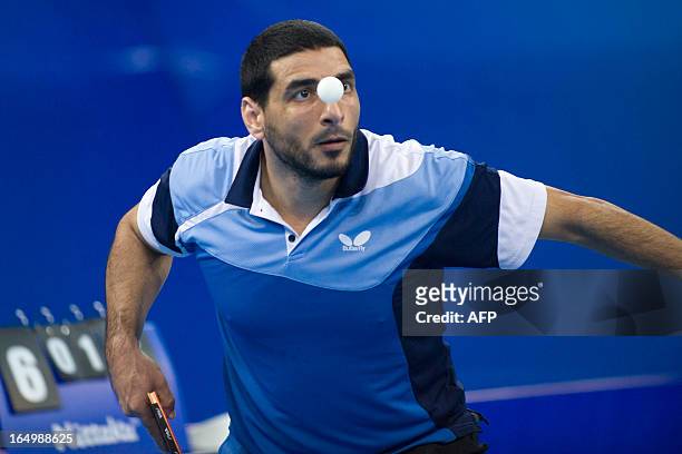 Sayed Lashin of Egypt serves during his match against Bastian Steger of Germany at the World Team Classic Table Tennis game in Guangzhou, east...