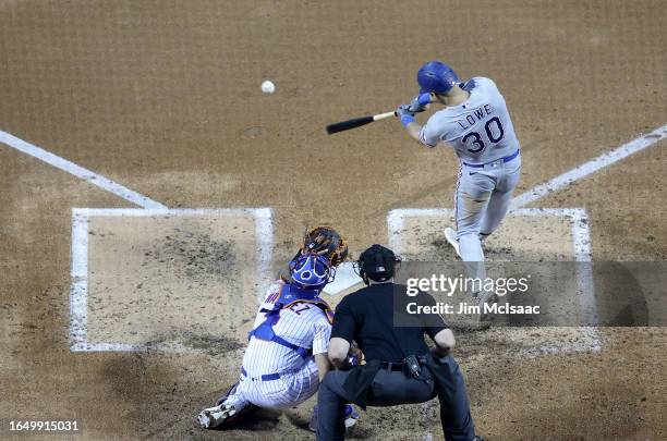 Nathaniel Lowe of the Texas Rangers in action against the New York Mets at Citi Field on August 30, 2023 in New York City. The Mets defeated the...