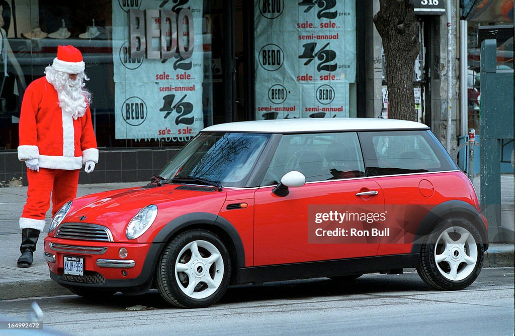 Mini Cooper 12/18/01The brand new Mini Cooper draws onlookers on Queen St