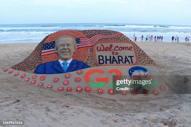 In this picture taken on September 6 a sand sculpture created by Indian sand artist Sudarsan Pattnaik representing US President Joe Biden's visit to...