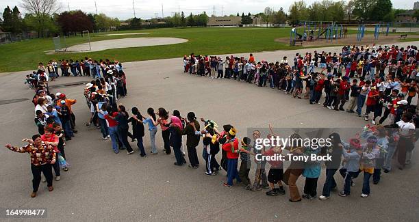 Heather Heights Public School in Scarborough, dances a conga line, for World Move for Health Day. The line is being led by Education Assistant Sandra...