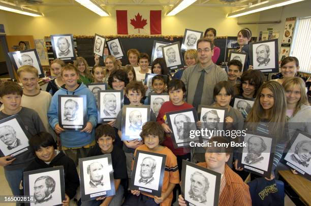 Antony Caruso with his grade 7 & 8 history class and the Fathers of Confederation, at Holy Spirit Catholic Elementary School, Aurora. He will be...