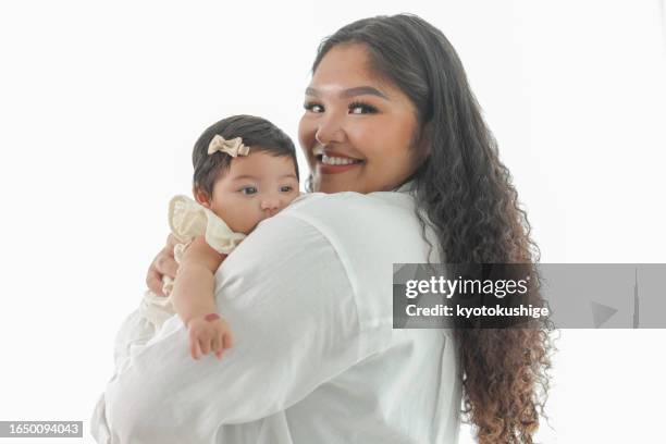 mother holding her baby girl - beautiful girls legs stock pictures, royalty-free photos & images