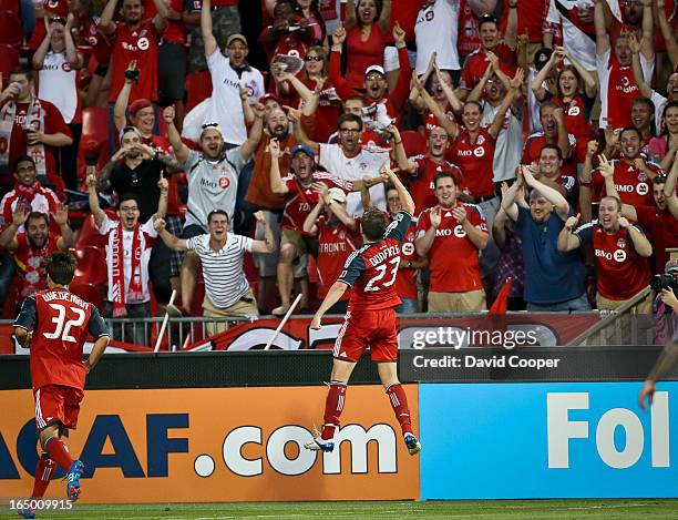 S Terry Dunfield celebrates his the third TFC goal with the fans during the first half of the game between TFC and CD Aguila of El Salvador in...