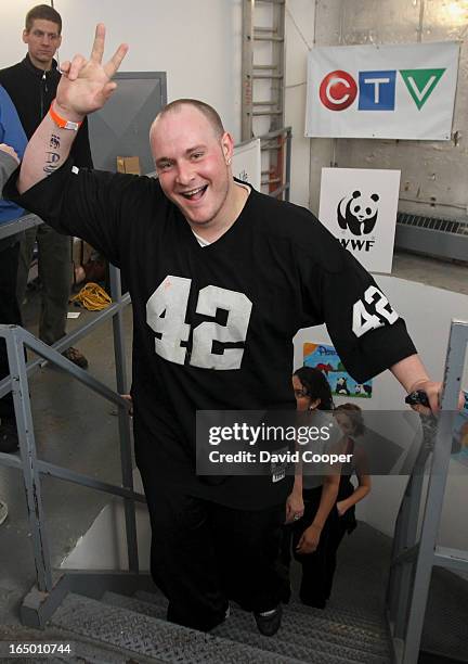 April 16 2011- Stephen Molnar 29 of Toronto give the victory sign as he crosses the finish line in the 21st Annual Canada Life CN Tower Climb for...