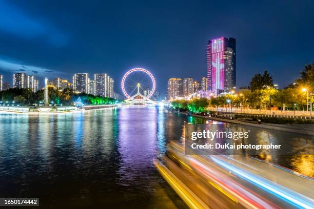 tianjin eye ferris wheel at night - tianjin stock pictures, royalty-free photos & images