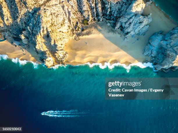 ocean waves are crashing the pacific ocean beach, baja california - baja california peninsula stock pictures, royalty-free photos & images
