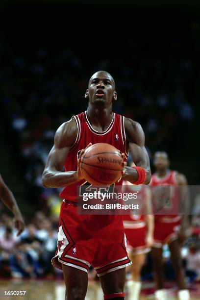 Michael Jordan of the Chicago Bulls takes a free throw during the 1990 NBA game against the Houston Rockets in Houston, Texas. NOTE TO USER: User...