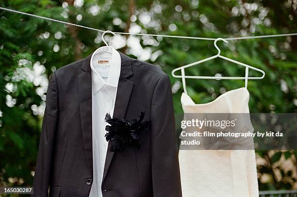 suit and gown - wedding dress on hanger stock pictures, royalty-free photos & images