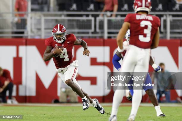 Alabama Crimson Tide quarterback Jalen Milroe runs with the ball during a college football game against the Middle Tennessee Blue Raiders on...