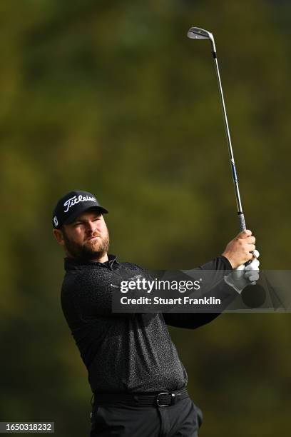 Jordan Smith of England plays their second shot on the 12th hole during Day One of the Omega European Masters at Crans-sur-Sierre Golf Club on August...