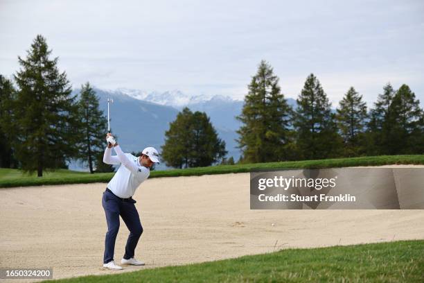 Edoardo Molinari of Italy plays a bunker shot for his second shot on the 1st hole during Day One of the Omega European Masters at Crans-sur-Sierre...